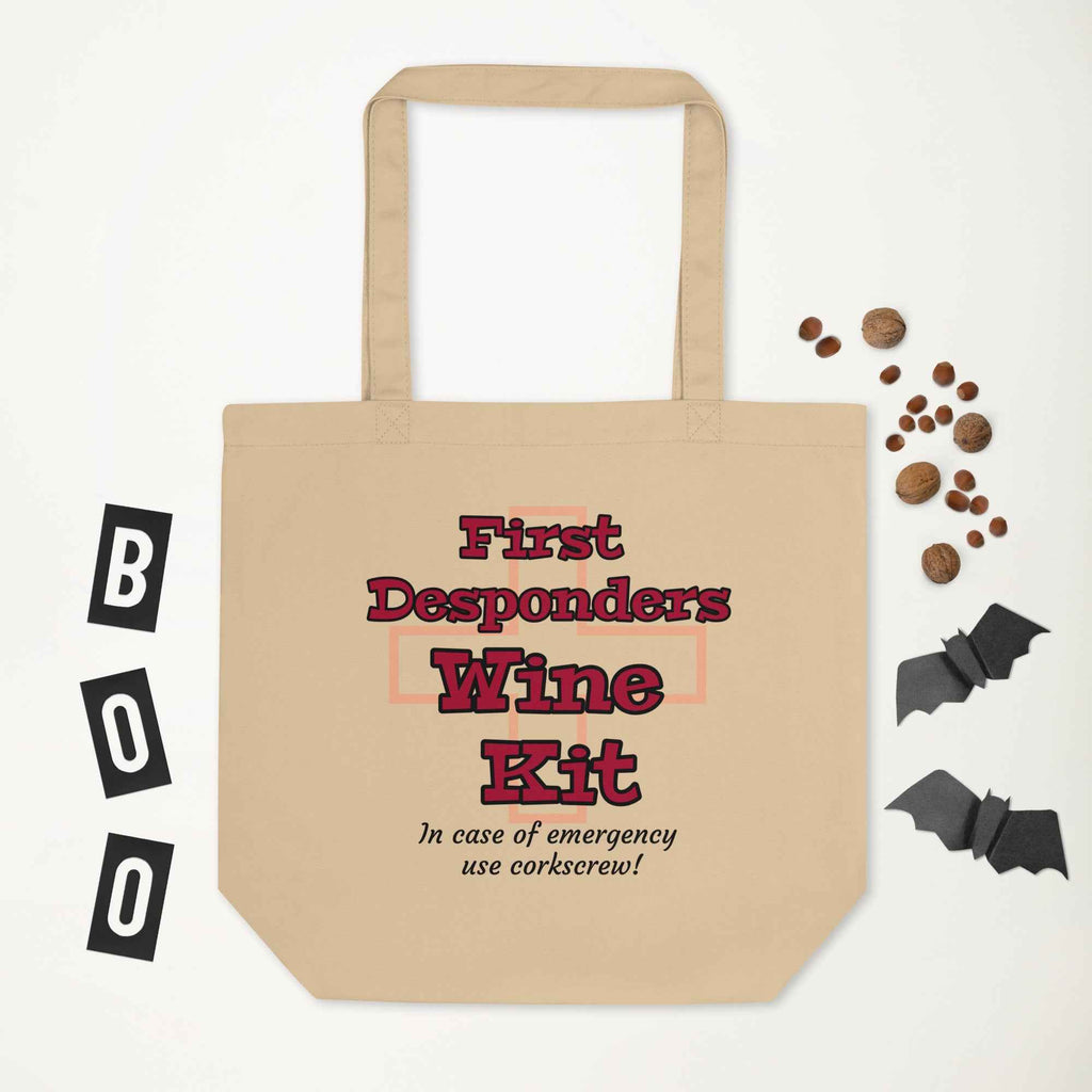 Humorous sign-style design with bold red and black text: “First Desponders Wine Kit—In case of emergency use corkscrew!” Features a faint red cross in the background. A parody of medical kits for wine enthusiasts.