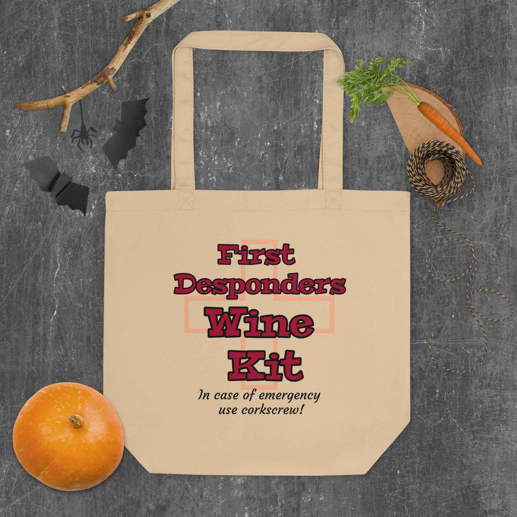 Humorous sign-style design with bold red and black text: “First Desponders Wine Kit—In case of emergency use corkscrew!” Features a faint red cross in the background. A parody of medical kits for wine enthusiasts.