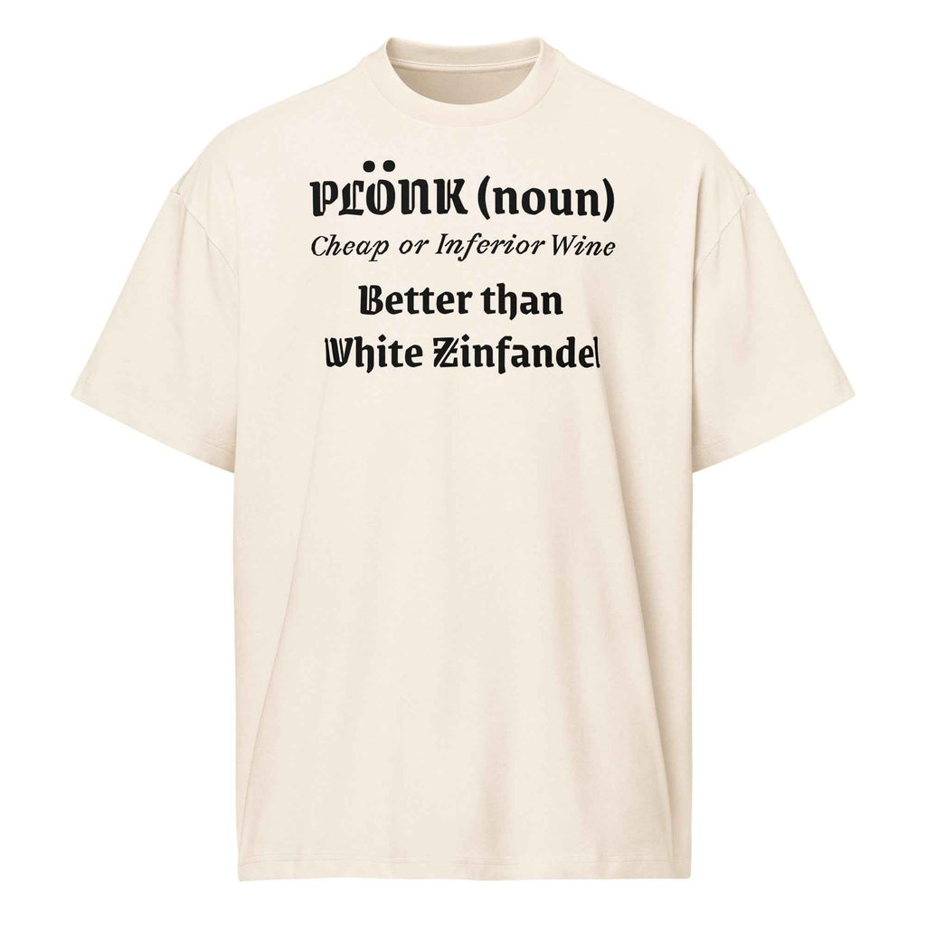 Eggshell cotton t-shirt laid flat with bold black text reading “Plonk; noun. Cheap wine, better than White Zinfandel.” Surrounded by retro wine props and blush-toned accents.