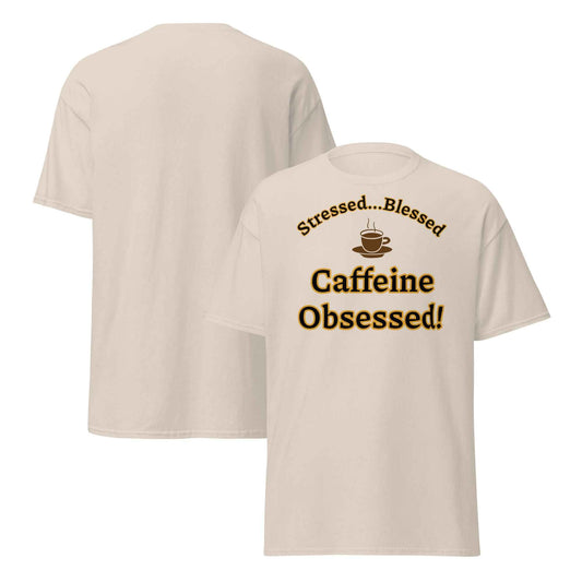 Beige t-shirt with a whipped cream coffee cup illustration and the phrase “Stressed…Blessed / Caffeine Obsessed!” in bold brown text.
