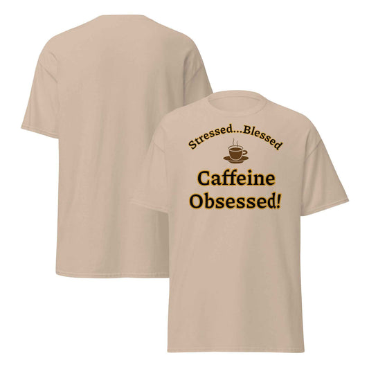 Beige t-shirt with a whipped cream coffee cup illustration and the phrase “Stressed…Blessed / Caffeine Obsessed!” in bold brown text.
