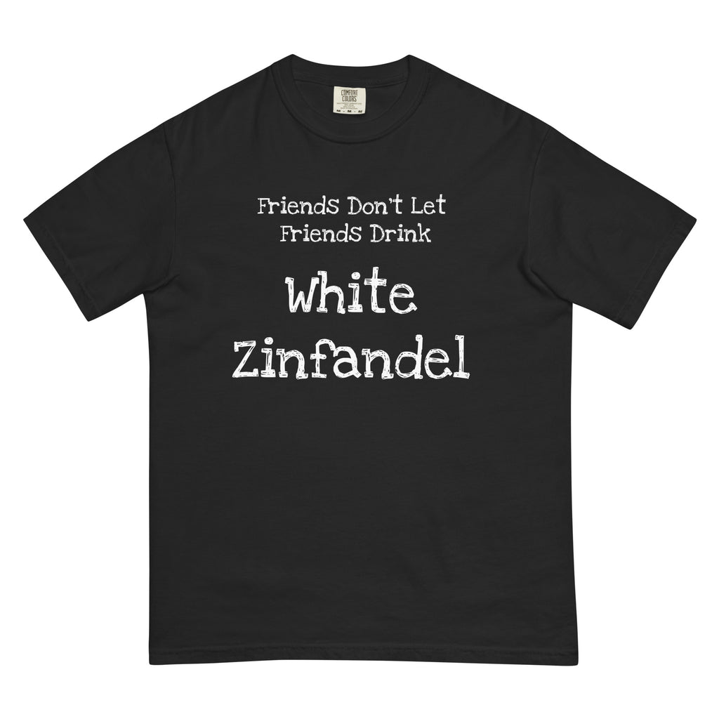 White cotton t-shirt laid flat with bold black text reading “Friends Don’t Let Friends Drink White Zinfandel.” Styled with retro wine props and blush-toned accents for a satirical, nostalgic vibe.