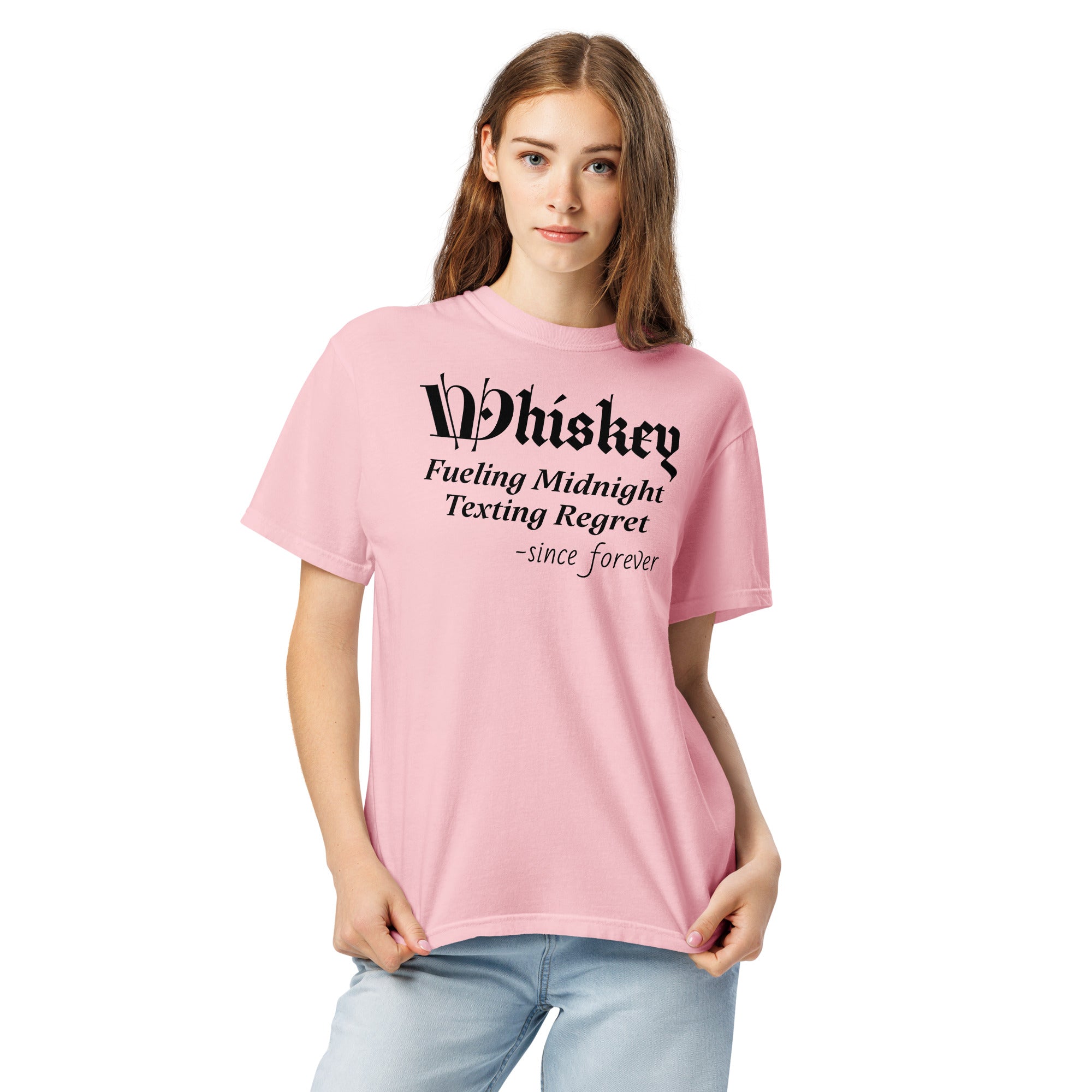  Pink T-shirt with stylized text: “Whiskey – Fueling Midnight Texting Regret – since forever.” The word “Whiskey” is in a decorative font; the rest is clean and readable. A humorous design referencing whiskey’s role in late-night texting decisions.