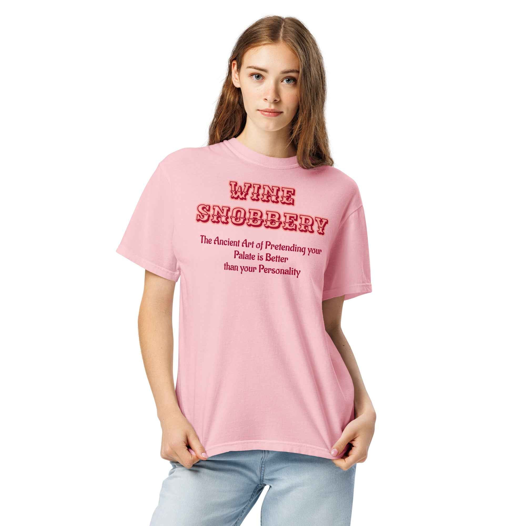 Pink T-shirt with bold red text reading “Wine Snobbery: The Ancient Art of Pretending your Palate is Better than your Personality.”
