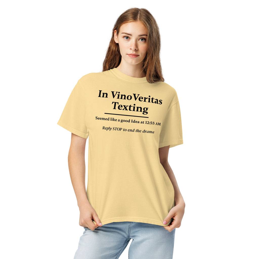 Light yellow T-shirt with bold black text that reads: “In Vino Veritas Texting — Seemed like a good idea at 12:55 AM. Reply STOP to end the drama.” A humorous nod to wine-fueled late-night texting and automated message culture.