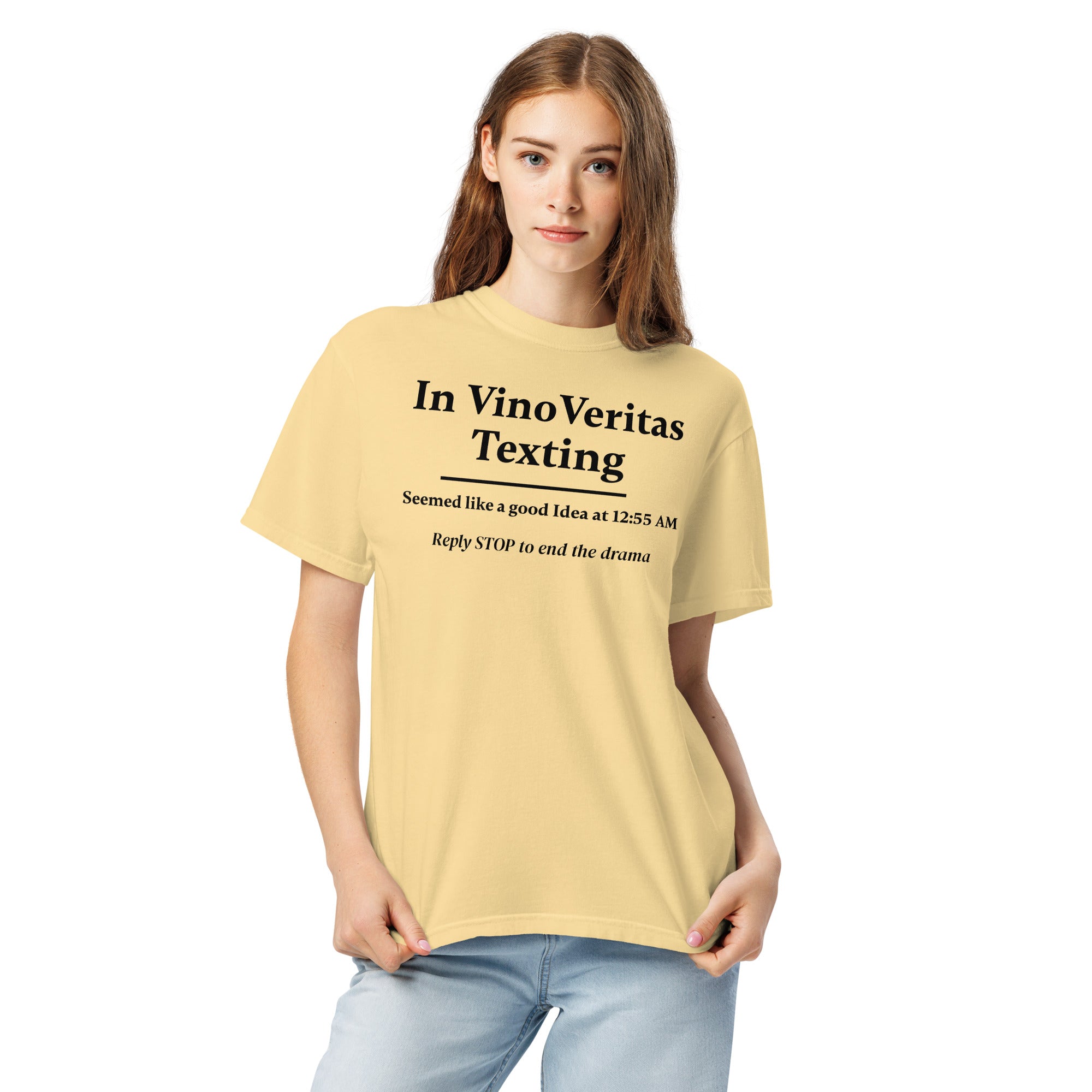 Light yellow T-shirt with bold black text that reads: “In Vino Veritas Texting — Seemed like a good idea at 12:55 AM. Reply STOP to end the drama.” A humorous nod to wine-fueled late-night texting and automated message culture.