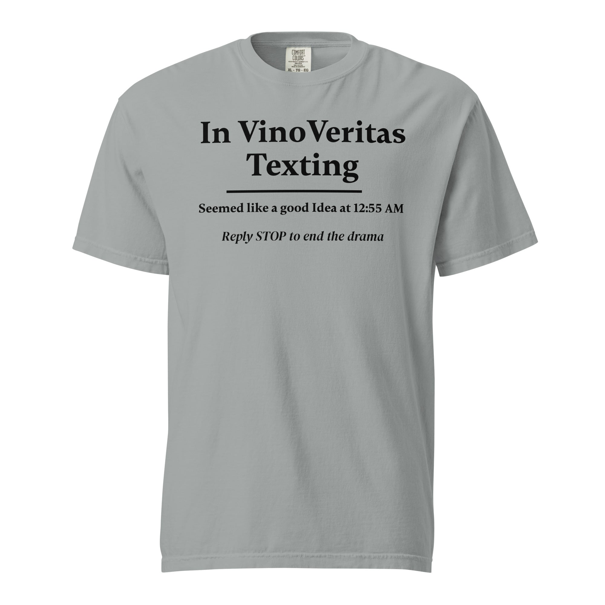 Light gray T-shirt with bold black text that reads: “In Vino Veritas Texting — Seemed like a good idea at 12:55 AM. Reply STOP to end the drama.” A humorous nod to wine-fueled late-night texting and automated message culture.
