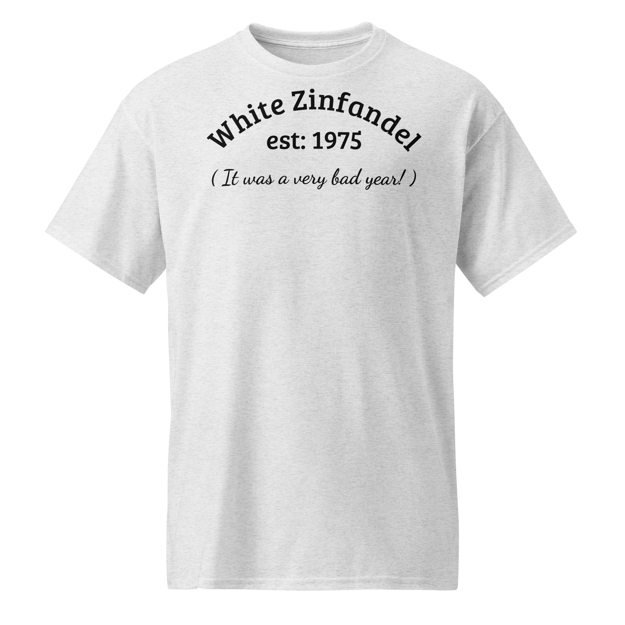 Light grey cotton t-shirt with bold black text reading “White Zinfandel – Established 1975 – It Was a Very Bad Year,” styled with wine corks, vintage glasses, and a half-empty bottle to evoke sweet regret and wine trail nostalgia.
 