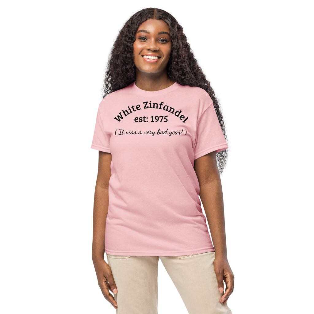 cotton t-shirt with bold black text reading “White Zinfandel – Established 1975 – It Was a Very Bad Year,” styled with wine corks, vintage glasses, and a half-empty bottle to evoke sweet regret and wine trail nostalgia.
