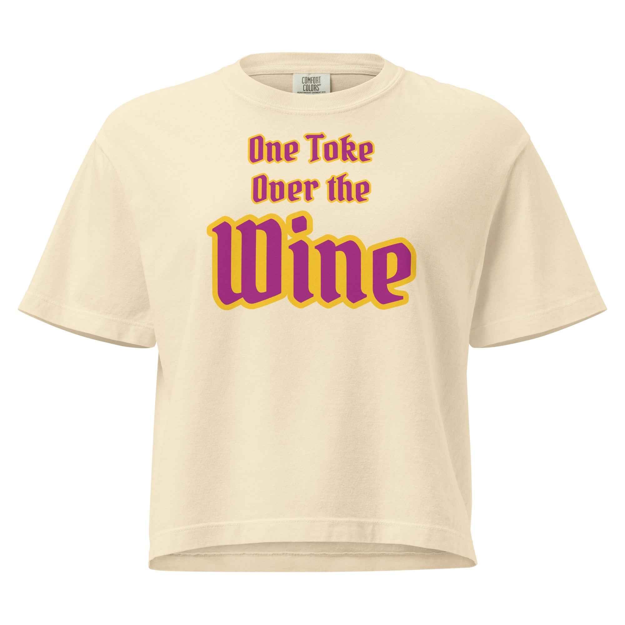 Light yellow t-shirt with stylized text reading 'One Toke Over the Wine'—a playful, wine-themed phrase with bold emphasis on 'Wine' for visual and narrative impact."